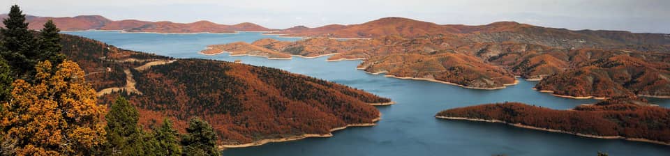 Lake Plastiras winding between autumn hills